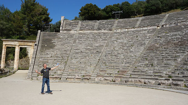 Rick Steves in ancient theater, Epidavros, Greece