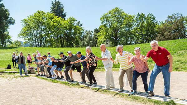 group of people standing at starting blocks in the original olympics site