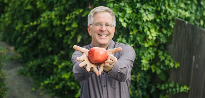 Rick holding apple