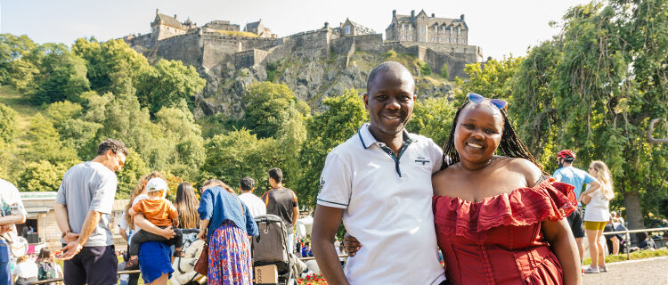 Young smiling couple at Edinburgh Castle, Edinburgh, Scotland