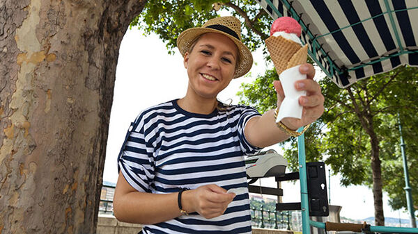 Lady in striped shirt with ice cream cone