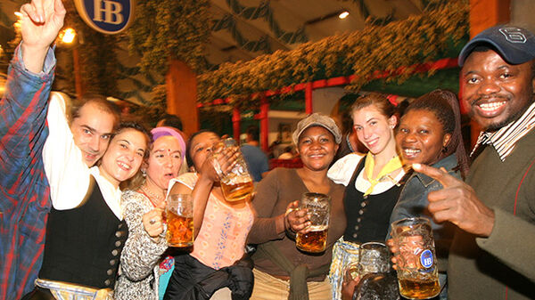 Happy group of people at the Hofbräuhaus, Munich, Germany
