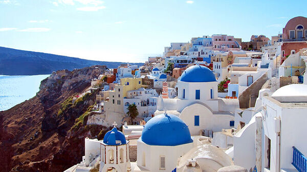 Overview of rooftops and coastline, Santorini, Greece