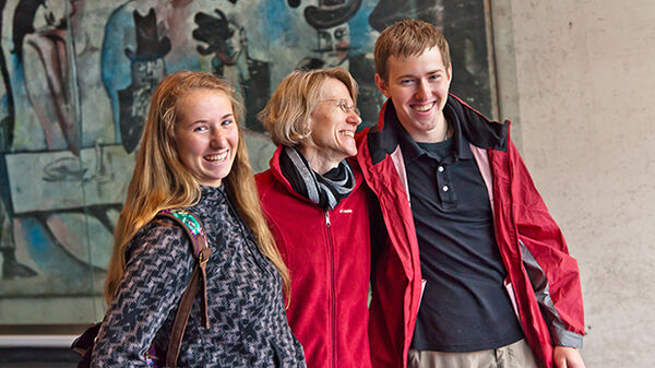Smiling trio at museum, Berlin, Germany