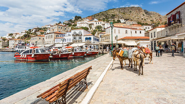 Donkeys and boats at harbor, Hydra, Greece