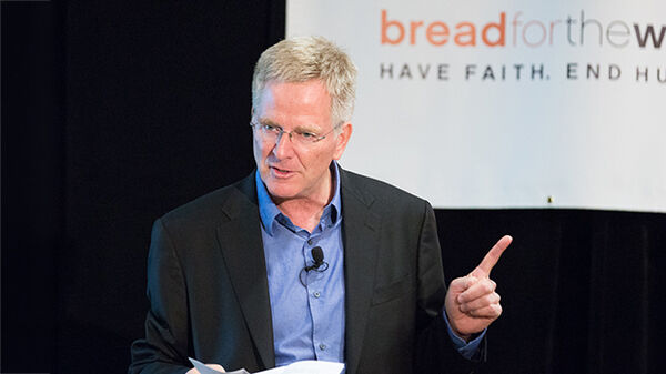 man speaking to audience
